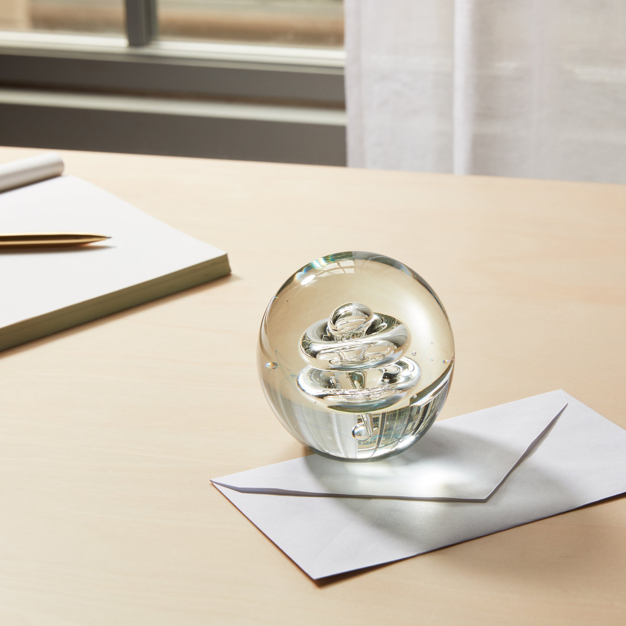 MoMA Exclusive Handmade Glass Paperweight with Spiral Rings – Desk Art Decor
